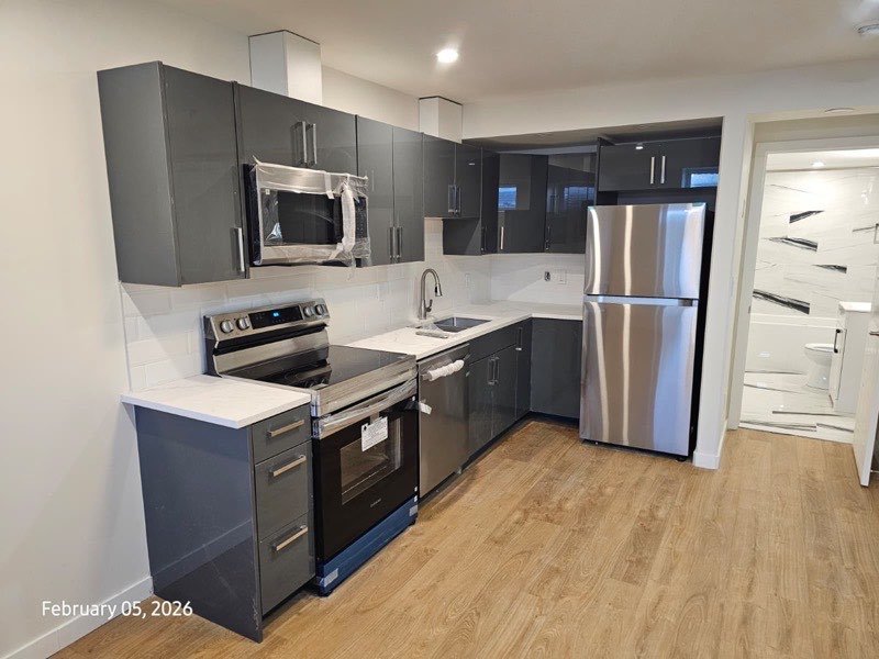 Modern dark grey kitchen by Monarch Cabinets