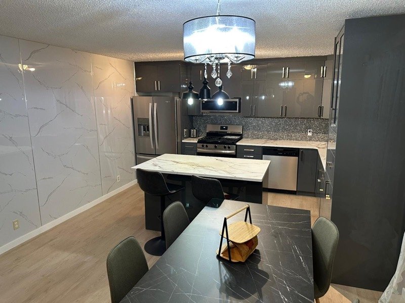 Dark island kitchen by Monarch Cabinets
